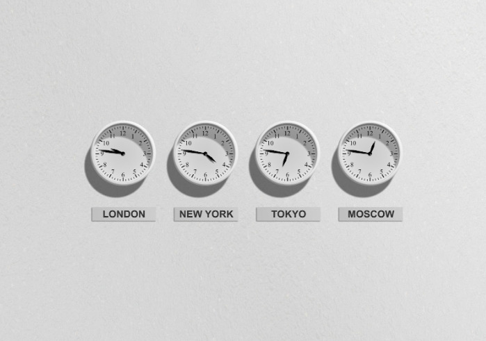Four clocks showing the different timezones of London, New York, Tokyo and Moscow