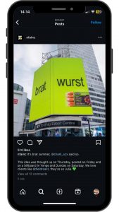 demure vs brat: brat-wurst billboard